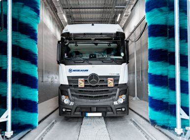 Truck in a car wash and disinfection area
